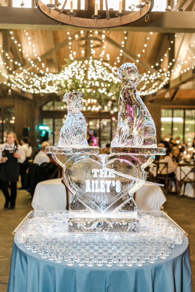 An ice sculpture of two dogs in the middle of a wedding reception at The Farm at Old Edwards Inn in Highlands, North Carolina. 