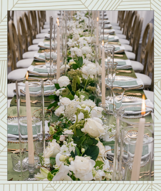 Mountain wedding reception with greenery and chandeliers