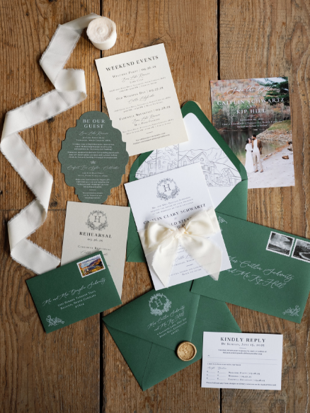 Wedding invitation suite with green envelopes and ribbon